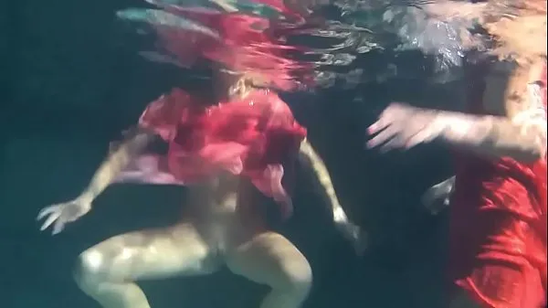 Two hot lesbians underwater touching each-other. y. s are naked in the pool. Young nudists Tabung hangat yang besar