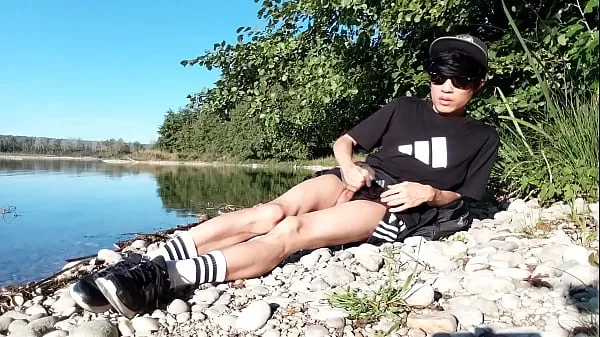 Big Jon Arteen wanks outdoor on a pebbles beach, the sexy twink wearing short shorts cums on his thigh, and cumplay warm Tube
