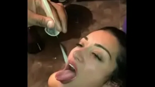 Big Married woman swallowing cum from a condom warm Tube